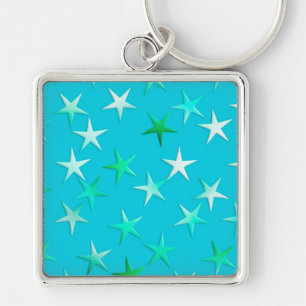 Satin sterren, bleek groen en blauw op turquoise sleutelhanger