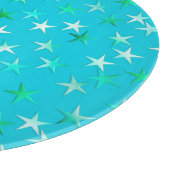 Satin sterren, bleek groen en blauw op turquoise snijplank (Hoek)