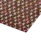 Satin sterren, roze op chocolade snijplank (Hoek)