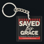 Saved by Grace Alamina Church of Christ key chain Sleutelhanger<br><div class="desc">"Saved by Grace" Keychain – Alameda Church of Christ Celebrate faith and strength with this inspiring "Saved by Grace" t-shirt, featuring 2 Corinthians 12:9: “My grace is sufficient for you, for my power is made perfect in weakness.” Perfect for members of Alameda Church of Christ or anyone wanting to share...</div>