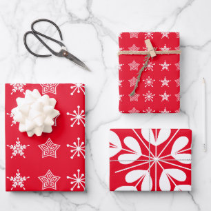 Scandinavische kerststerren in wit, rood inpakpapier vel