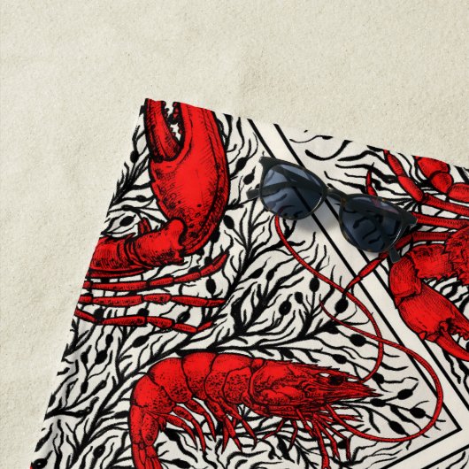 Schaaldieren in rood, zwart en ivoor strandlaken (In situ)