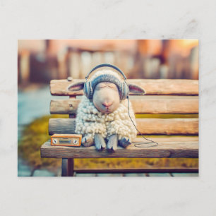 Schaap dat met koptelefoon op een bank dut feestdagenkaart