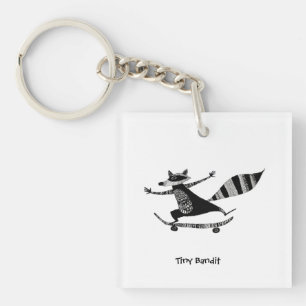 Schaatsende wasbeer – Whimsical wasbeer dier Sleutelhanger