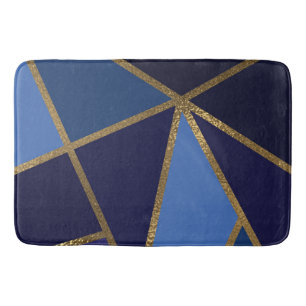 Schakeringen van blauw en goud bronzen geometrisch badmat
