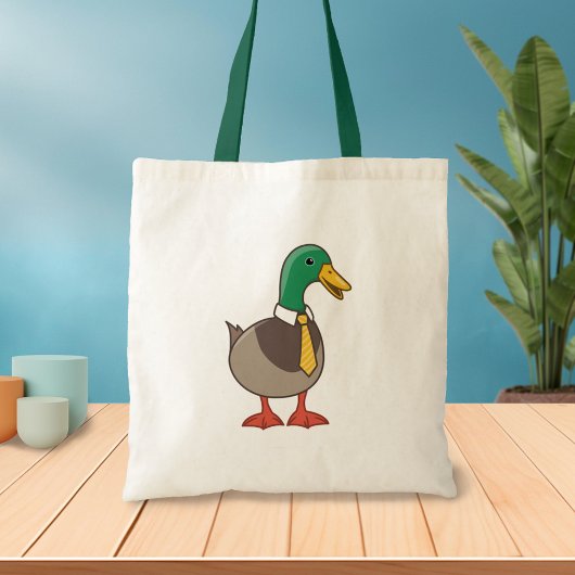 Schattelijke cartoon wilde eend met stropdas tote bag