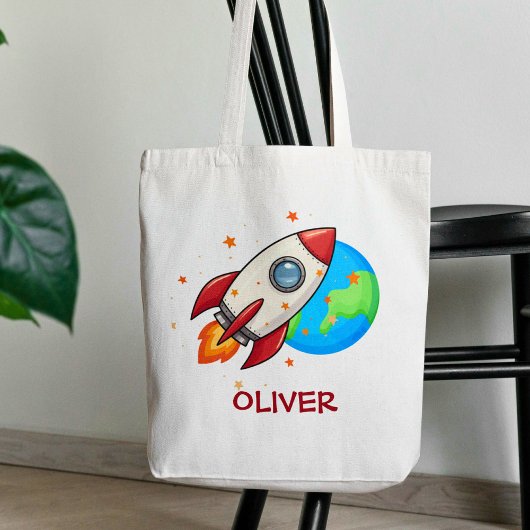 Schattelijke rode raket in de ruimte tote bag