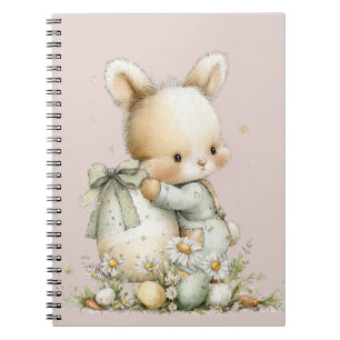 Schattig baby konijn in pyjama met een paasei notitieboek