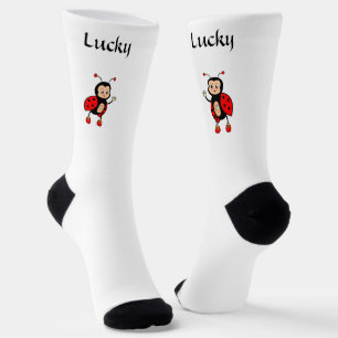 Schattig gelukkig rood lieveheersbeestje op witte  sokken