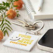 Schattig glimlachend gezicht & positieve quote dub sleutelhanger (Voorkant Rechts)