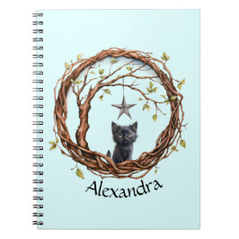 Schattig zwart katje dat naar een ster kijkt notitieboek