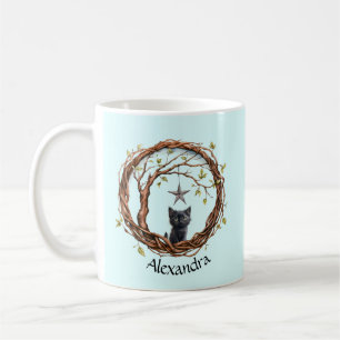 Schattig zwart katje kijkt naar een ster koffiemok