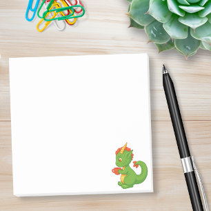 Schattige baby-draak houdt kopje vast post-it® notes
