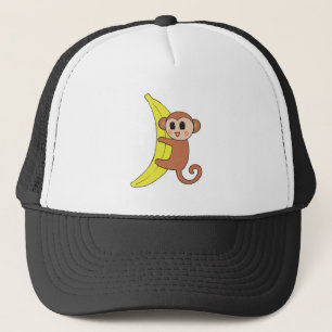 schattige babyaap op banaan trucker pet