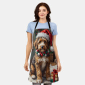 Schattige Bernedoodle-hond met warme gebreide kers Schort (Gedragen)