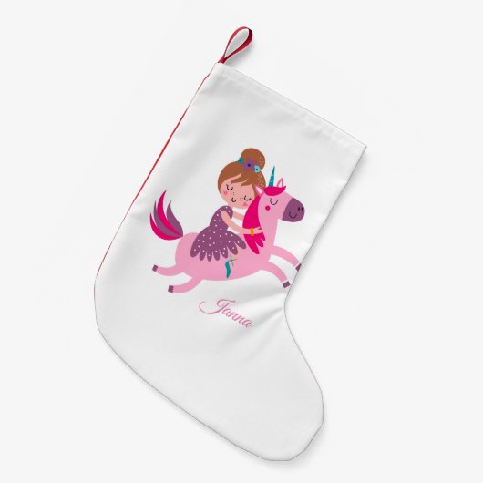 Schattige blondine haired meisje rijden op een een kleine kerstsok (Voorkant (Hangend))