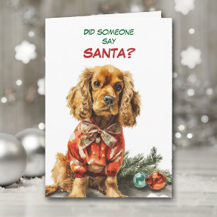 Schattige Cocker Spaniel hond zoekt naar Kerstman Feestdagen Kaart