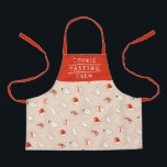 Schattige Cookie Tasting Crew Kerstpatroon Schort<br><div class="desc">Dit leuke vakantiebakpatroon heeft een schort van ijskoekjes voor Kerstmis - een kerstmuts, sneeuwpop, kerstboom, een engel, wanten en een snoepriet. De tekst luidt: "COOKIE TASTING CREW", maar het kan worden aangepast om te zeggen wat je maar wil. :) Het rood is een soort oranje - rode kleur, en de...</div>