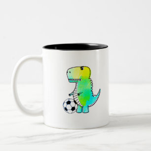 Schattige dinosaurus houdt van voetbal aquarel tweekleurige koffiemok