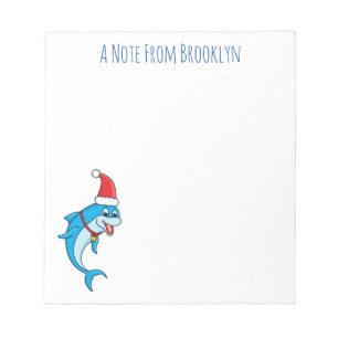 Schattige dolfijn met kerstmuts cartoon notitieblok