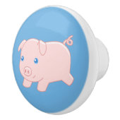 Schattige draaiende biggen op blauw keramische knop (Rechts)