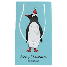 Schattige Gentoo-pinguïn met een kerstmuts op een  Klein Cadeauzakje