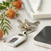 Schattige glimlende Otter in het meer Sleutelhanger (Zijkant)