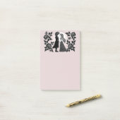 Schattige gothische emo-kinderen zoenen op valenti post-it® notes (Op bureau)