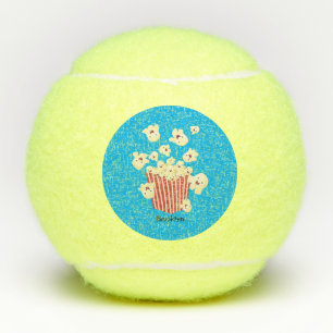 Schattige grappige springende popcorn-cartoon tennisballen