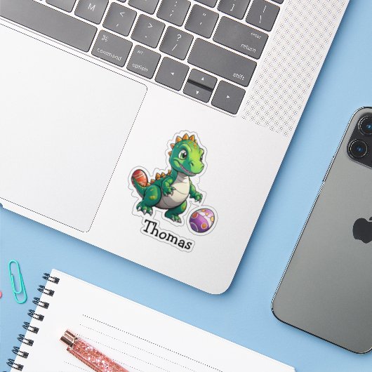 Schattige groene dinosaurus met Pasen eieren Sticker (Laptop met iPhone)