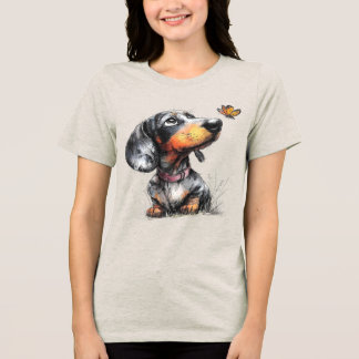 Schattige hond die naar een vlinder kijkt Tri-Blend shirt
