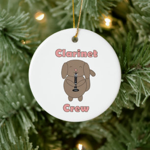 Schattige hond speelt klarinetmuziek keramisch ornament