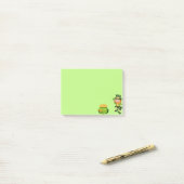Schattige kabouter & pot met goud op limoengroen post-it® notes (Op bureau)