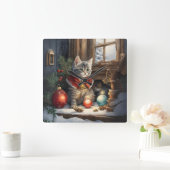 Schattige kat in rode kaap met kerst vierkante klok (Huis)