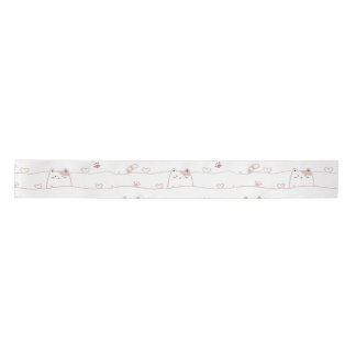Schattige katten die over harten gluren satijnen lint