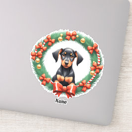 Schattige kerst doberman pup in feestelijke krans sticker