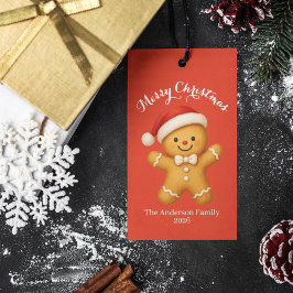 Schattige kerstman van gemberkoek met kerstmannenh cadeaulabel