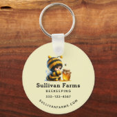 Schattige meisje in bijenkostuum met honinghandel sleutelhanger (Voorkant)