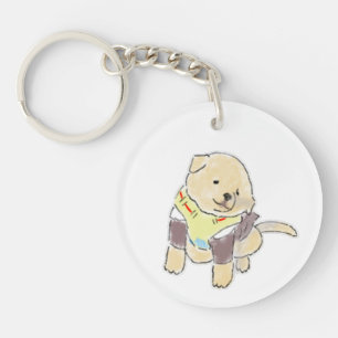 Schattige met de hand getekende gouden pup met tui sleutelhanger