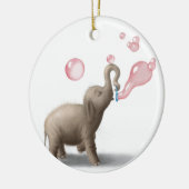 schattige olifant blaast roze bellen op keramisch ornament (Links)