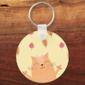Schattige Oranje Kat Speelt in de Bladeren van de Sleutelhanger (Achterkant)