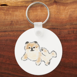 Schattige Pluizige Pomeranian Pup Lying Down Sleutelhanger