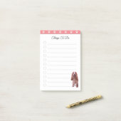 Schattige puppyhond op roze en witte dingen om te  post-it® notes (Op bureau)