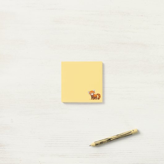 Schattige rode panda op geel post-it® notes (Op bureau)