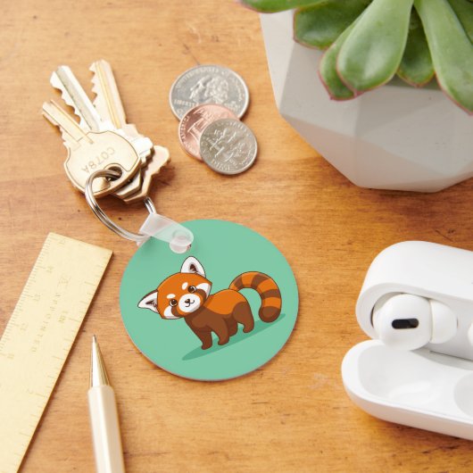 Schattige rode panda op groen sleutelhanger (Bureau)