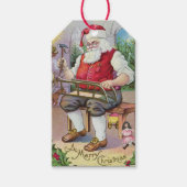 Schattige  Santa Making a Sled Gift Label Cadeaulabel (Voorkant)