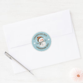 “Schattige Sneeuwman met Kerstkaart – Feestelijke Ronde Sticker