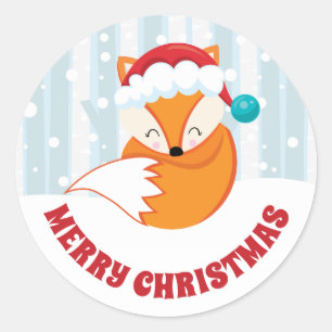 Schattige vos in kerstmuts in besneeuwd bos kerstf ronde sticker