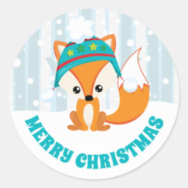 Schattige vos in winterhoed in besneeuwd bos kerst ronde sticker