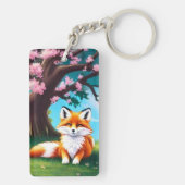 Schattige vos zit onder de boom sleutelhanger (achterkant)